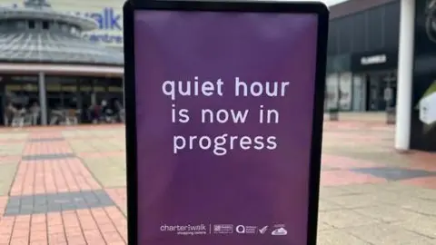Charter Walk Shopping Centre Sign outside the shopping centre reading 'quiet hour is now in progress'.