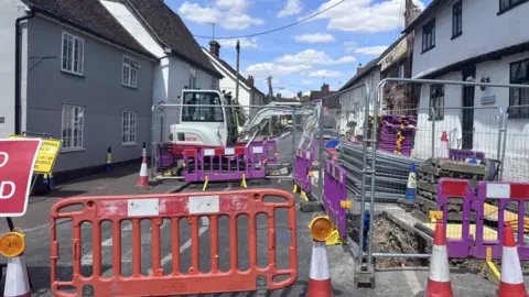 Matt Marvel/BBC A high street that has been closed off for roadworks. Part of the road has been dug up and there are cones and barriers blocking people off. There is also a digger parked on the road.