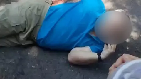 One of the stabbed men on the ground