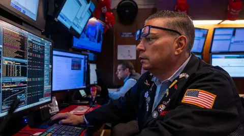 Getty Images Traders work on the floor of the New York Stock Exchange (NYSE) on July 30, 2025 in New York City.