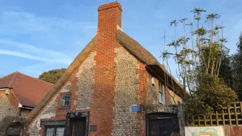 BBC / Danny Pike A 17 Century cottage with a newly restored thatched roof. 