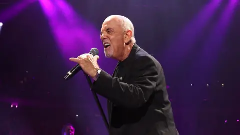 Getty Images Billy Joel performing at his piano