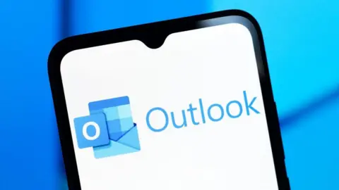The Microsoft Outlook name and logo on a phone screen