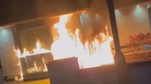 A house with flames coming out of it