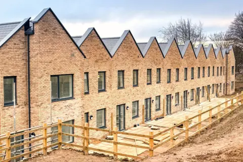 Getty Images A row of terraced houses is under construction
