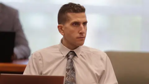 Reuters Bryan Kohberger wears a white shirt and tie with stern expression