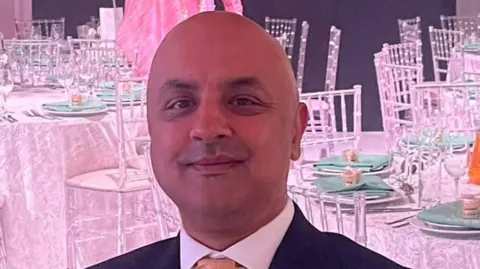 Supplied A headshot of Herpreet Nirwal - a bald, middle aged man of south Asian origin
