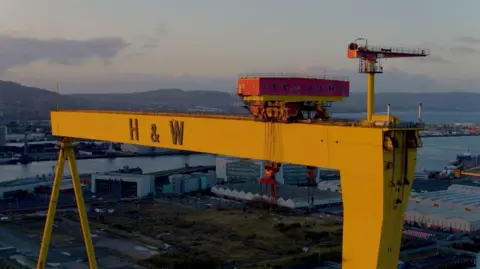 BBC The yellow cranes dominate the Belfast skyline