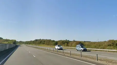 Google A photo of the A5, a dual carriageway with a central reservation, with cars travelling in both directions