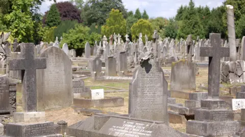 BBC A wide shot of many graves in St Marylebone Cemetery in Finchley, London.