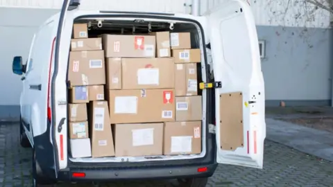 Getty Images White van filled with parcels