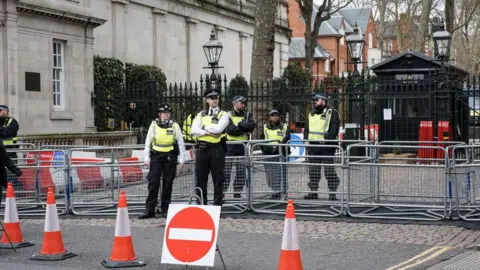 Getty Images Police block the entrance to the Israeli embassy in March 2025