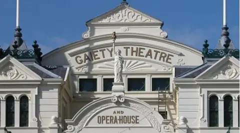 The front of the top of the Victorian-era theatre, which has Gaiety Theatre and Opera House in lettering on the front.