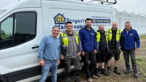 Double H Nurseries Six men are stood in front of a white van smiling at the camera.