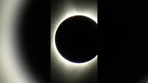 The moon covering the sun so only the light is visible around the outside