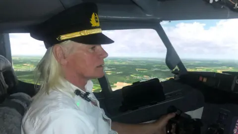 John Devine/BBC Tim Procter in his flight simulator