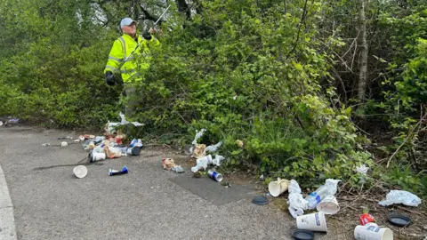 Ron Ford picking litter at a site near Cwmbran