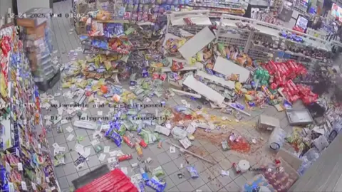 Items from the convenience store are scattered as robbers attempted to steal an ATM machine.