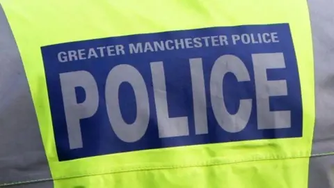 Greater Manchester Police yellow high-vis jacket