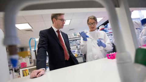 Professor Quentin Anstee in a lab with researchers at Newcastle University