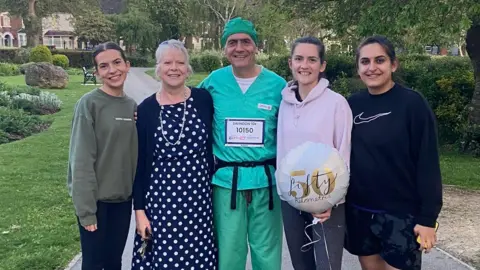 Mark Hillyard Mr Hillyard in the middle of a family group of five