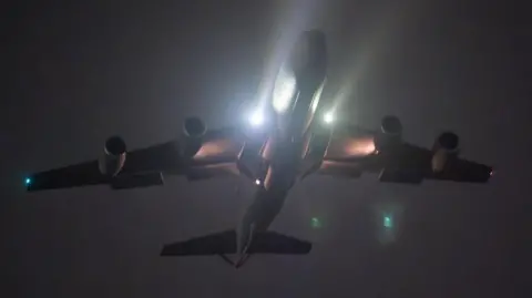 US Air Force/Reuters A night-time image in which a KC-135 Stratotanker aircraft takes off from a base in the U.S. Central Command area of responsibility in support of Operation Hawkeye Strike, its lights full-beam