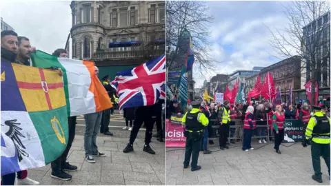 Two groups, each holding flags, are shown. 