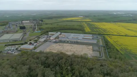 Ant Saddington/BBC A drone image of Yarl's Wood. It shows the entire centre from above. Several buildings can be seen as well as a large open area. Fields surround the centre.