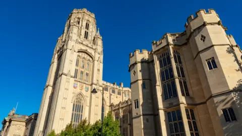 The image of the Wills Memorial Building in the Getty Image Bristol, behind which has a bright blue sky.