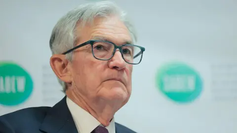 Close up of Federal Reserve chair Jerome Powell wearing a blue suit