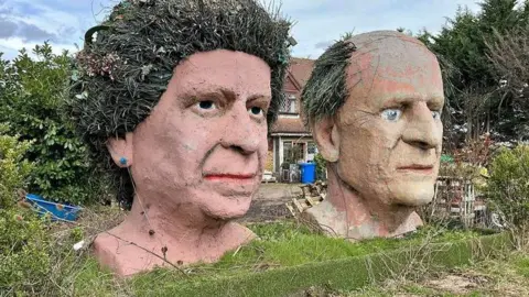 Ben Inglis/Facebook Giant statues of Queen Elizabeth II and Prince Philip