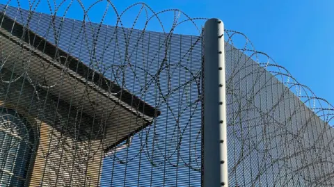 Getty Images A barbed wire fence