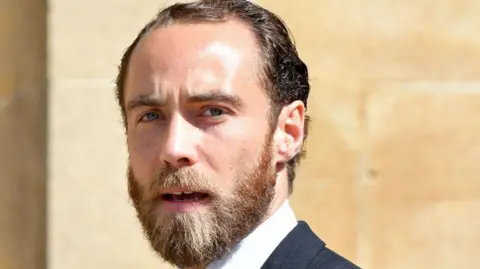 James Middleton wearing a suit and tie 