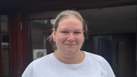 George King/BBC A head and shoulders picture of Natalie Hull. She is wearing a light grey top and smiling into the camera.
