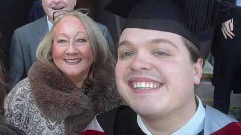Beverley Place and her son Will Place at his graduation. Both are smiling