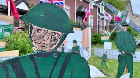 Plasterboard soldiers in a garden in Somerset