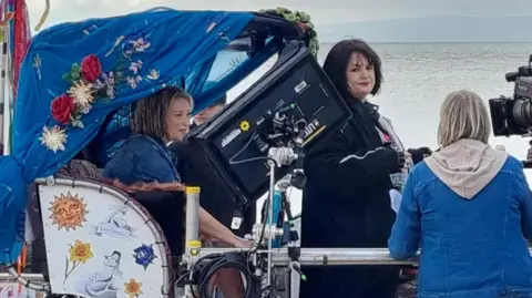 Joanna Page, as Stacey, and Ruth Jones, as Nessa, were seen filming on Barry Island seafront on Tuesday morning