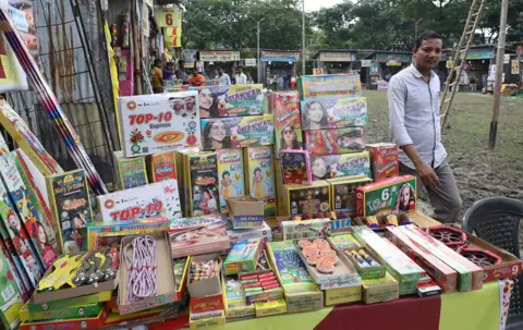 Getty Images A man walks past a stall at a pre-Diwali fireworks fair in Kolkata on October 29, 2024