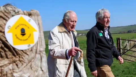 King Charles III and Tony Juniper, Natural England Chair walk the King Charles III England Coast Path as he inaugurates the King Charles III England Coast Path at Seven Sisters National Nature Reserve on March 19, 2026 in Seaford, England