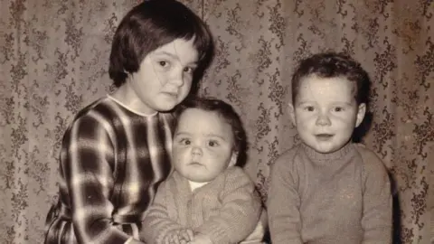Family photo A black and white photo of the three siblings