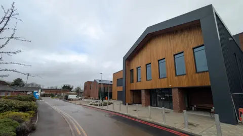 BBC External view of the Carsington unit's entrance, a brick and wood structure