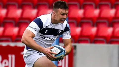 Charlie Powell running with the ball