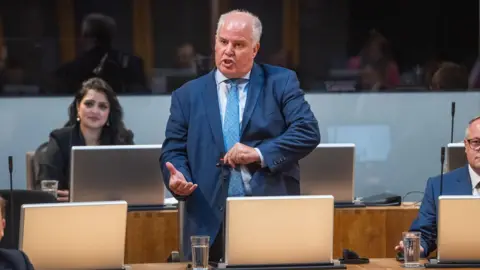 Senedd Cymru Andrew RT Davies speaking in the Senedd chamber