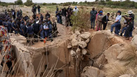 Members of the Reuters community watched as South Africa's Minister of Police, Senzo Mchunu, inspected the outside of a mine shaft where hundreds of illegal miners are believed to be hiding underground.