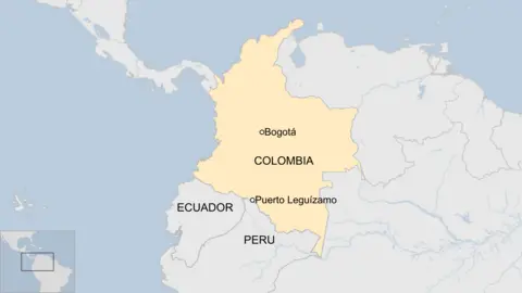 A map shows Colombia and neighbouring Ecuador and Peru. It marks the location of Puerto Leguízamo, a town near Colombia's border with Peru.