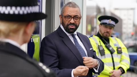 James Cleverly with officers in Crawley