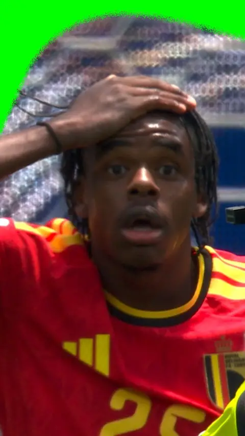 Julien Ngoy reacts to getting a red card in the 2026 World Cup