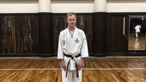 Alex Hodgson in his karate uniform