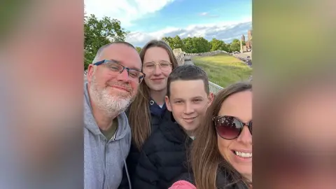 Family photograph A family selfie of Harry's father, Keith, sister Phoebe, Harry and his mother Lucy all smiling.