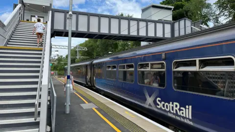 BBC A ScotRail train at the newly opened Giffnock station on the East Kilbride line